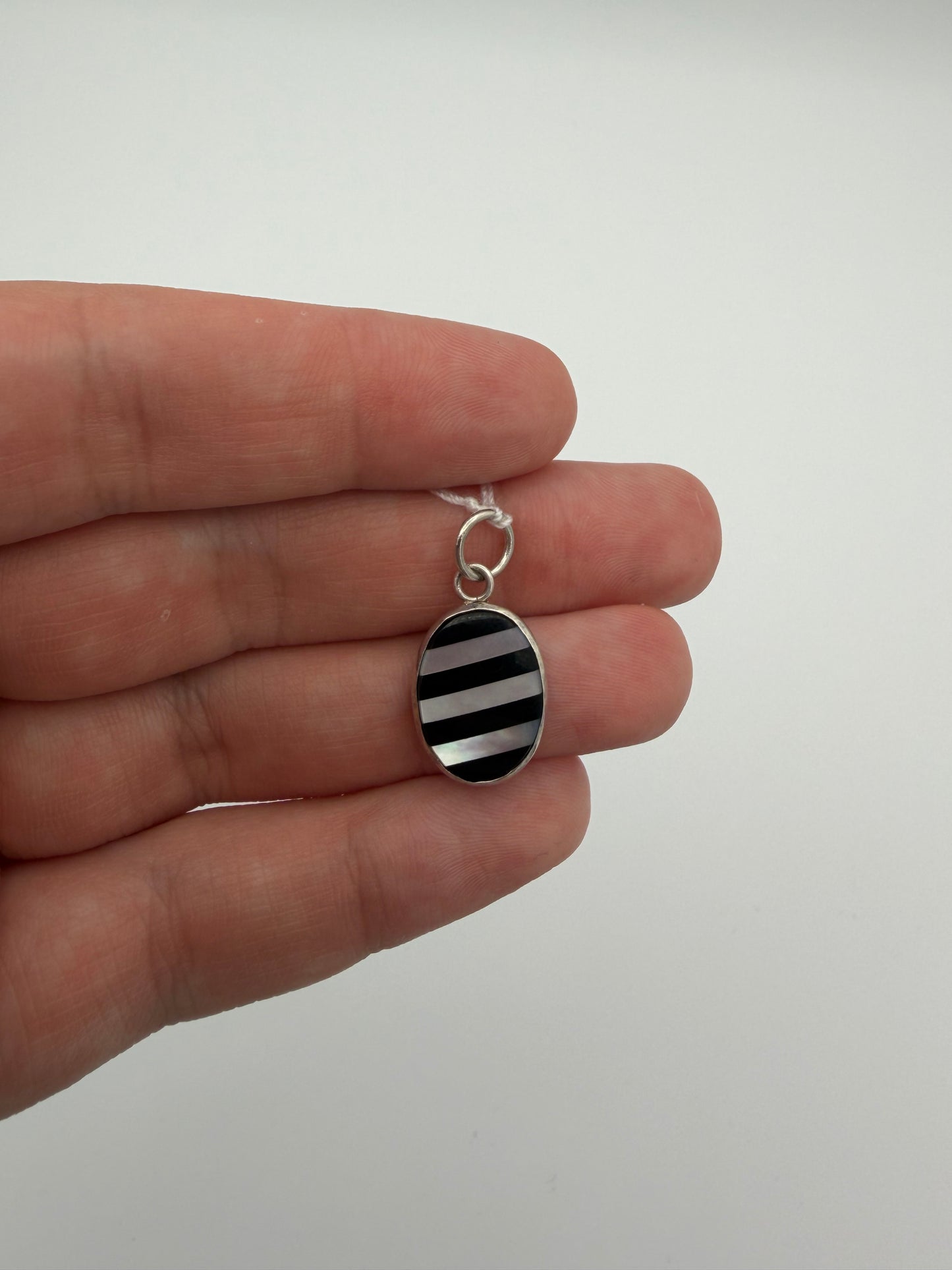 Onyx and Mother of Pearl Stripe Charm